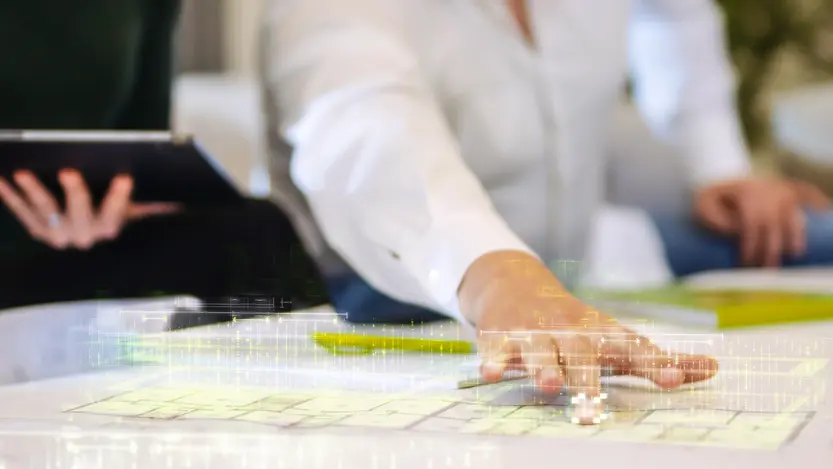 weisenburger_bau_innovation_banner A man demonstrates something on an innovative floor plan