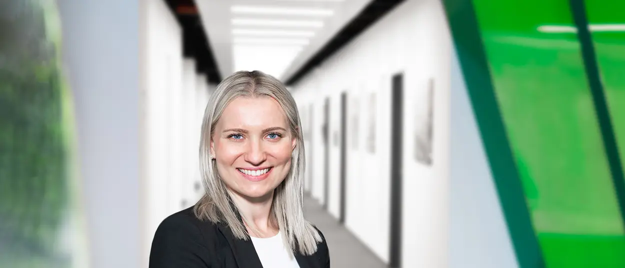 sampling_center_Link_to_Services a woman in the sampling center is looking in the camera and holding a tablet