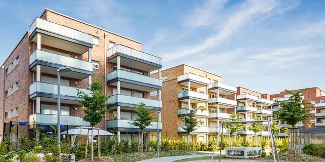 project development appartment buildings Apartment buildings in brick look with balconies and green areas