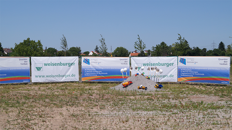 Quarter of diversity and weisenburger bau groundbreaking with toy excavators